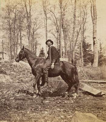 old photograph of man on a horse