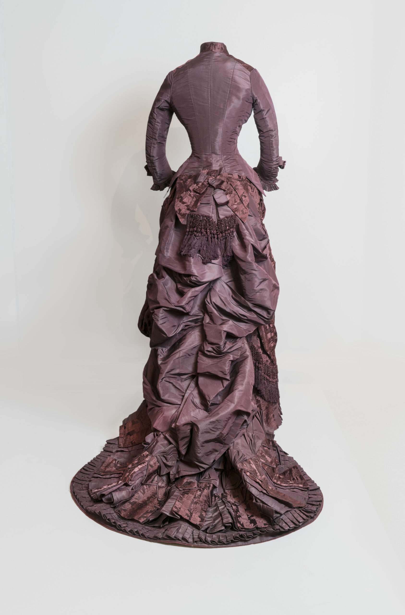 Back view of a layered purple dress.