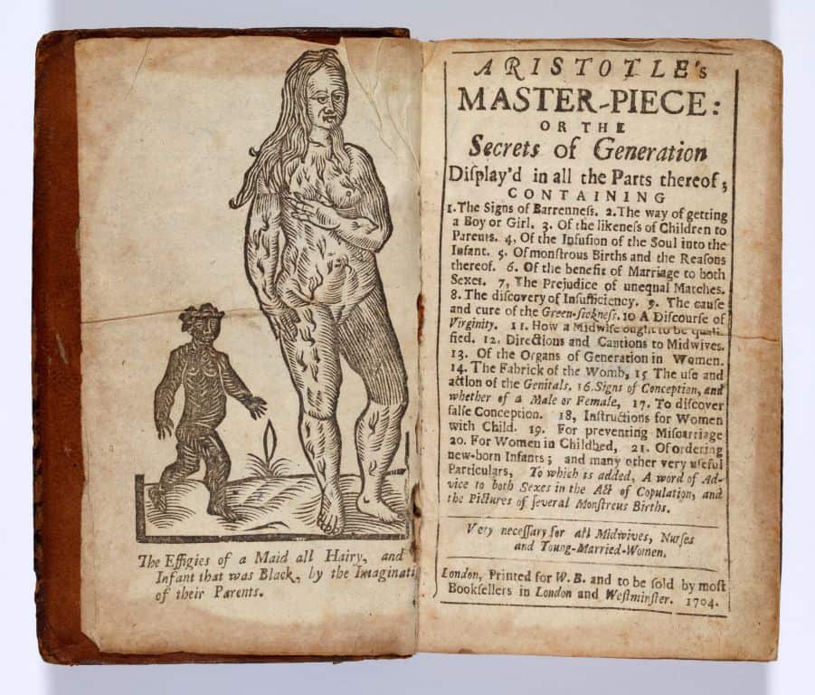 Frontispiece and contents page with an image of a nude female figure with hair all over her body. She has long hair to below her shoulders and is using one of her arms to point toward her breast. A small caricature of a black infant is shown with no distinct facial features colored-in black.
