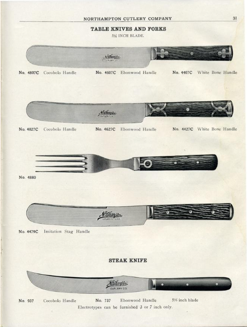 A catalog page from the Northampton Cutlery Company, numbered 31 at the top right, displays vintage table knives and forks in a clean, vertical arrangement against a plain, light background. The top section is titled "TABLE KNIVES AND FORKS" and features three knives and one fork, each with distinct, highly detailed handle designs. The first knife has a straight, wide blade and a dark wood handle detailed with small metallic cross-shaped accents. Below it, the second knife features a similar wide blade but with an ornate dark handle adorned with interlocking metallic silver ring patterns. The third item is a four-pronged fork with a dark, textured wood handle fixed with small rivets. The fourth item is a wide-bladed knife with a textured, dark "Imitation Stag" handle secured by three rivets. The bottom section of the page is titled "STEAK KNIFE" and displays a single knife featuring a long, upward-curved blade and a smooth, tapered black handle with two small rivets. Fine printed text below each item lists style numbers and material variations, such as Cocobolo, Ebonywood, and White Bone handles.