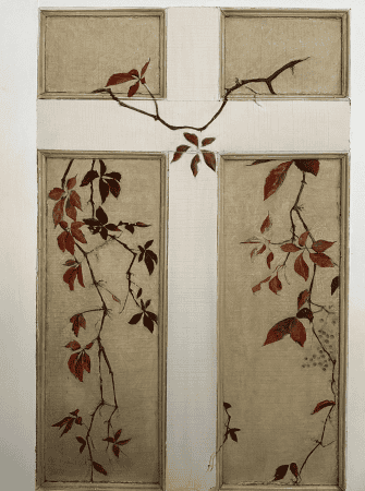 Photograph of a white door painted with an autumn leaf design. 
