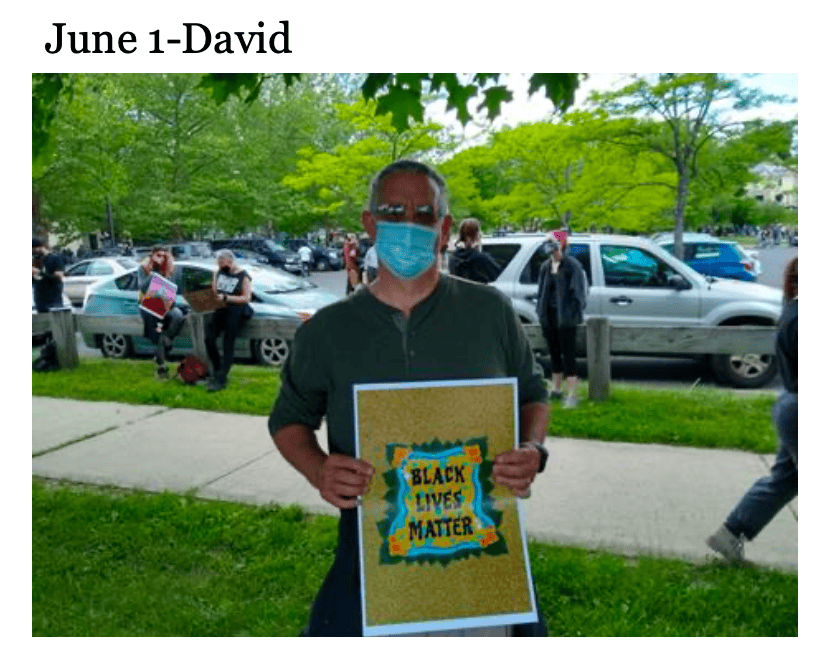 photo of man with Black Lives Matter sign