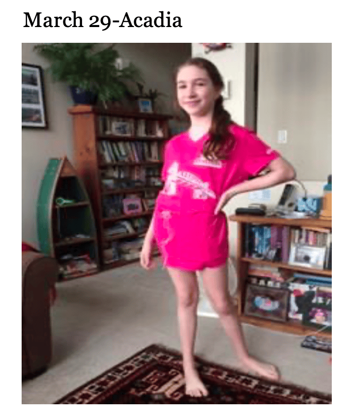 photo of young person in a bright pink t-shirt striking a pose