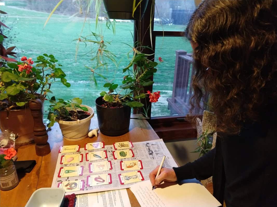 photo of person writing at a table