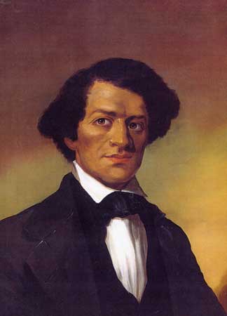 Portrait of Frederick Douglass as a young man, wearing a black suit with tie and white shirt