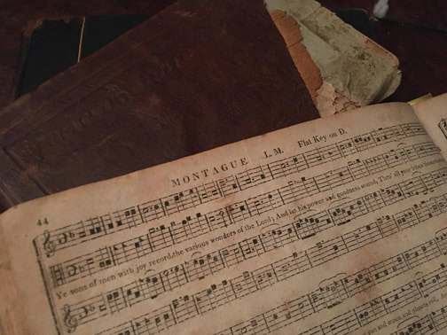 A photograph of a old book of music open to a page labeled Montague L. M. Flat Key on D.