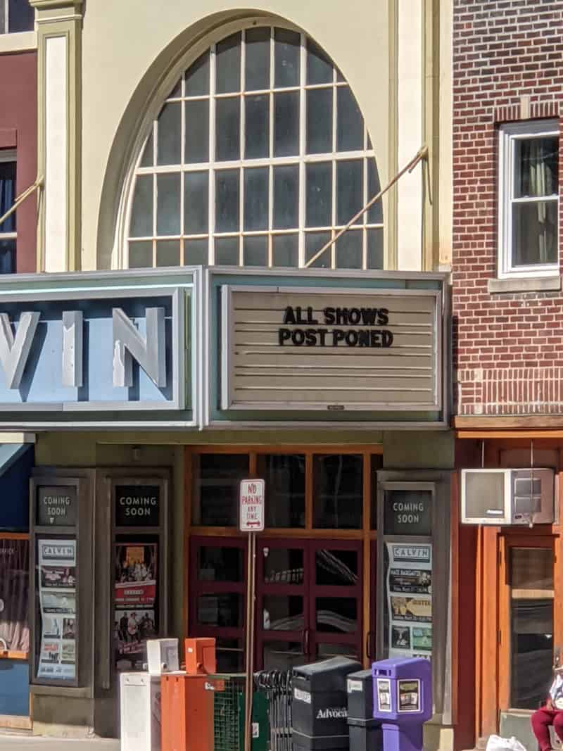 Photo of Calvin Theater marquee reading: "All Shows Postponed"