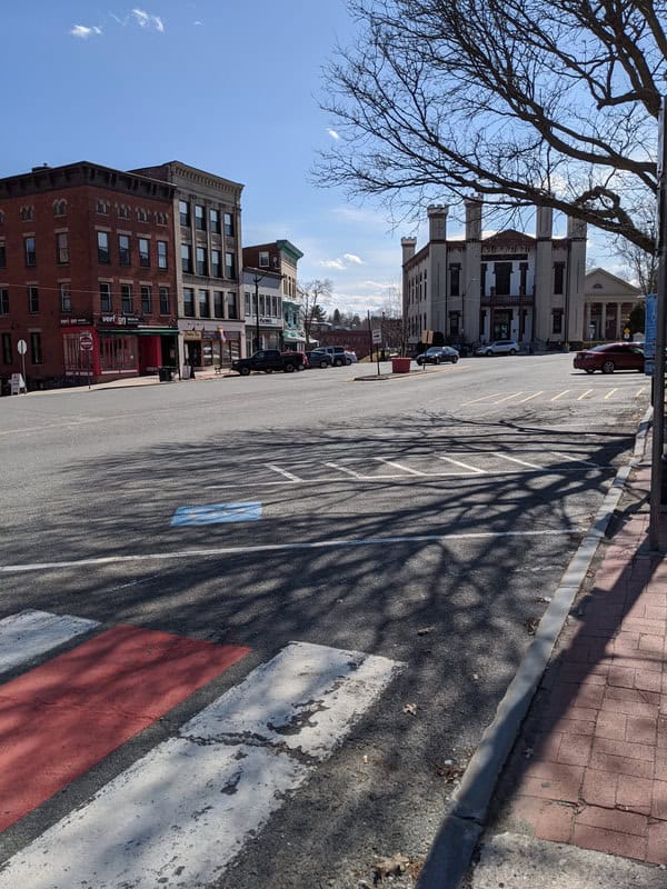 Photo of an empty center main street with City Hall in distance