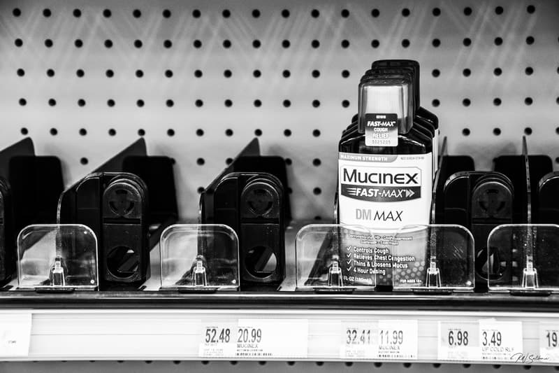Photo of empty store shelf with one bottle of Mucinex