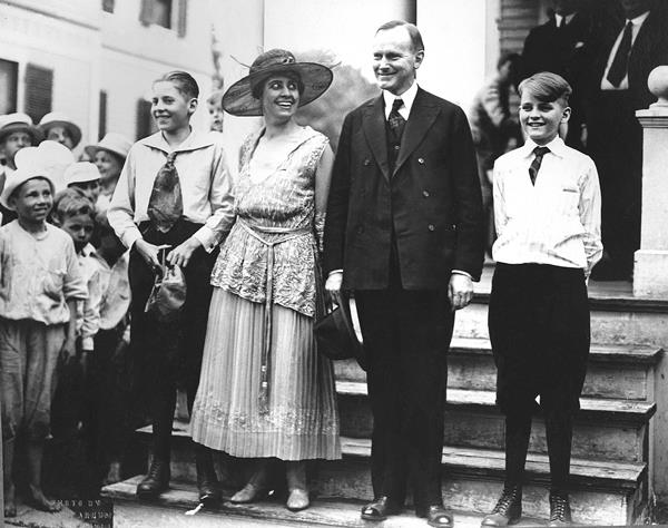 The Coolidge family (John, Grace, Calvin, and Calvin Jr.) on the steps of their home at 21 Massasoit St on Notification Day, July 27, 1920, when Coolidge was informed that he was his party’s nominee for president.