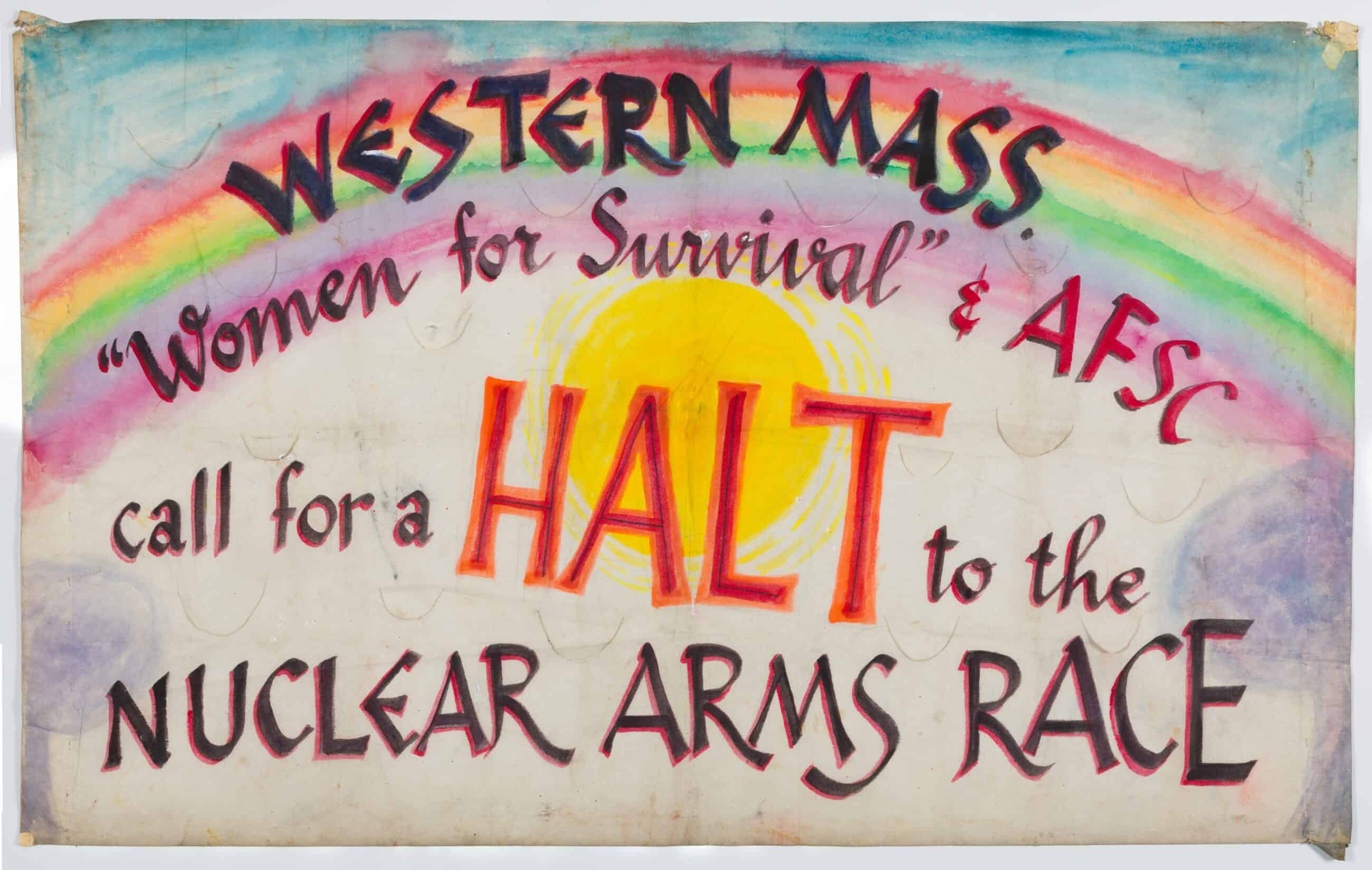 Portest banner. The banner has a rainbow and sun. Over this image reads: "WESTERN MASS. / "Women for Survival" & AFSC / call for a HALT to the / NUCLEAR ARMS RACE."