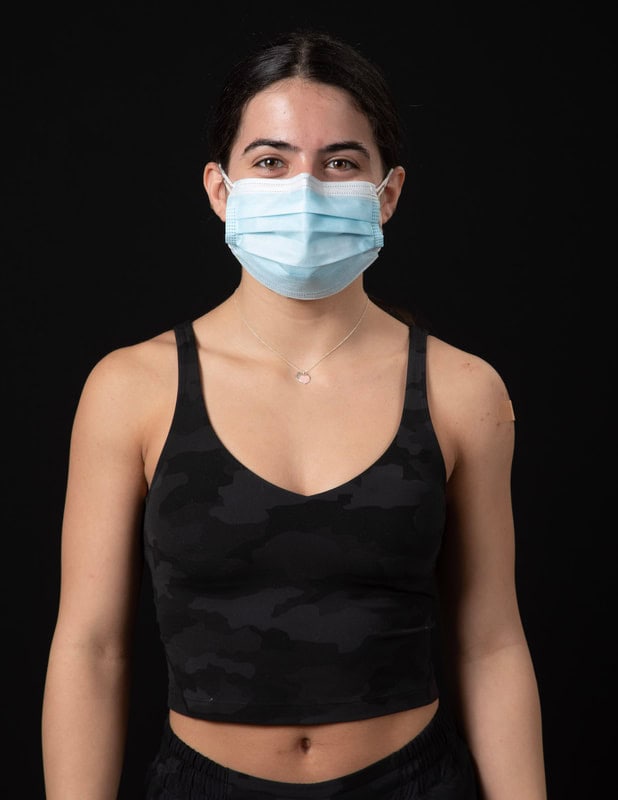photo of person in face mask and black sleeveless shirt