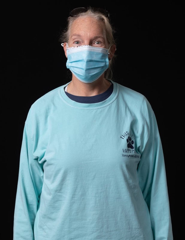 Photo of person wearing face mask and blue shirt