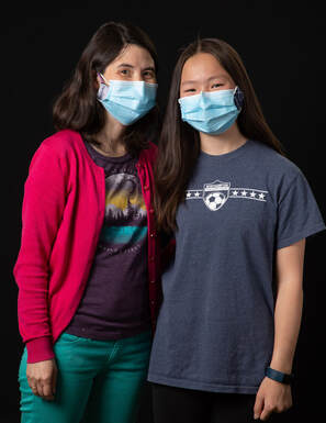 photo of two young people wearing face masks
