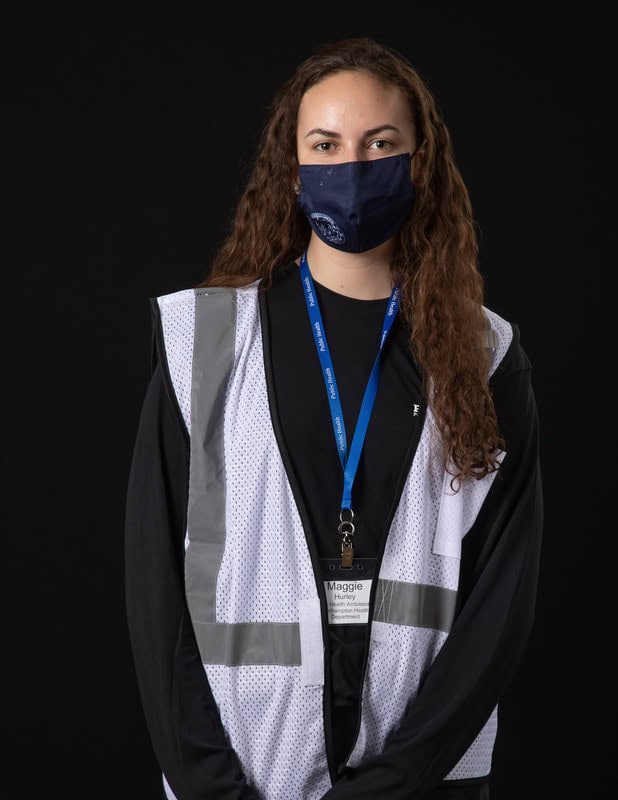 photo of person wearing face mask and white vest