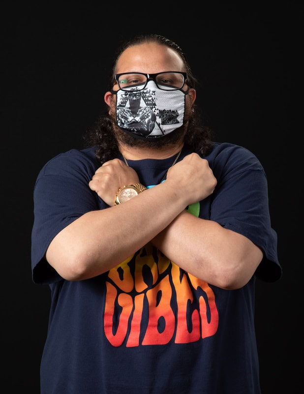 photo of person wearing illustrated face mask and holding their arms across their chest as a hug
