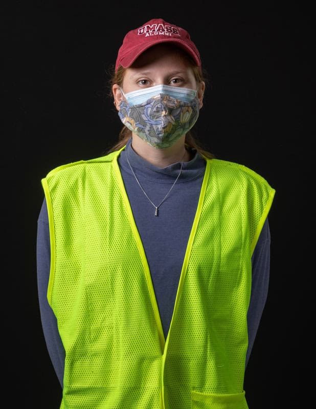 photo of person wearing face mask and a yellow vest