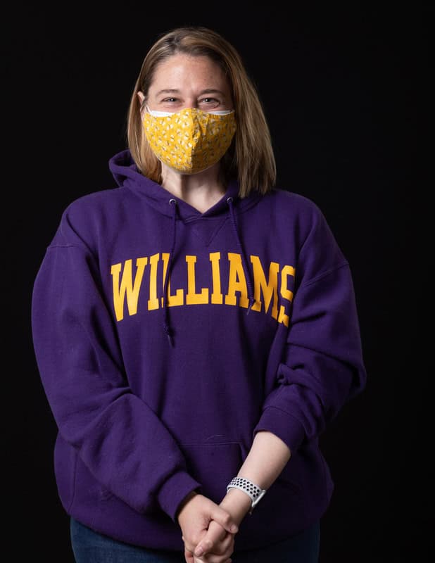 Photo of person wearing face mask and sweatshirt reading 'Williams'