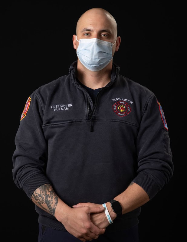 photo of person wearing face mask and a firefighter's uniform